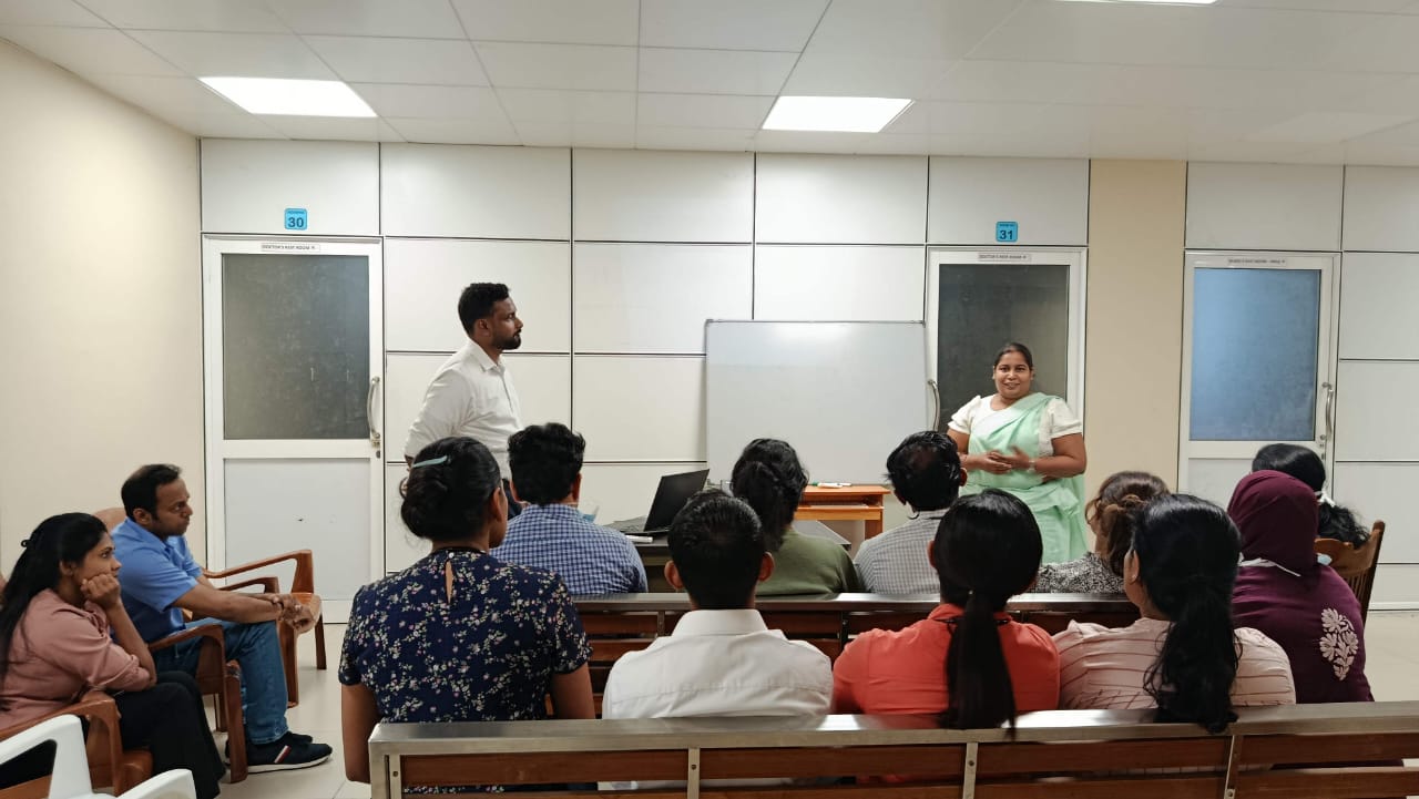 Dual lens refractory anaphylaxis discussion with registrars seated in front